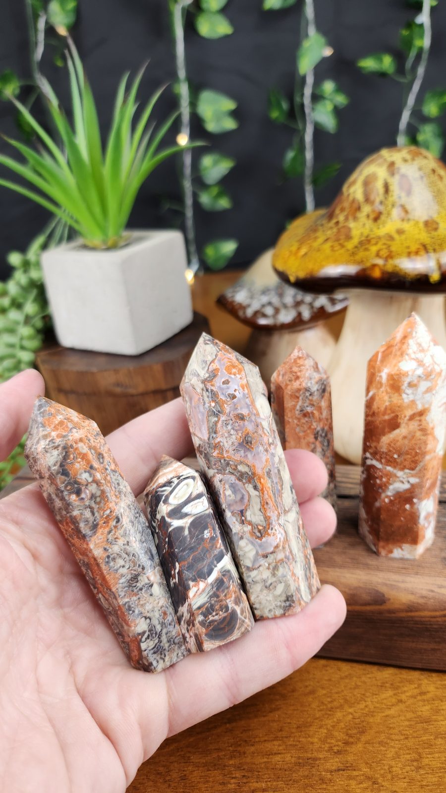 Money Agate Small Tower Crystals shown in hand for scale.